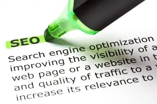 a close-up of a green highlighter on the word seo