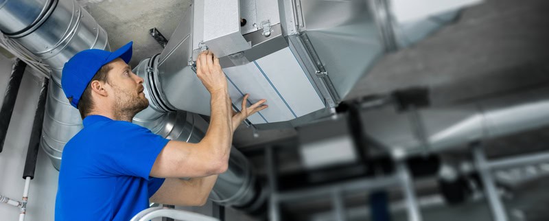 Ventilation system installation and repair service. hvac technician at work